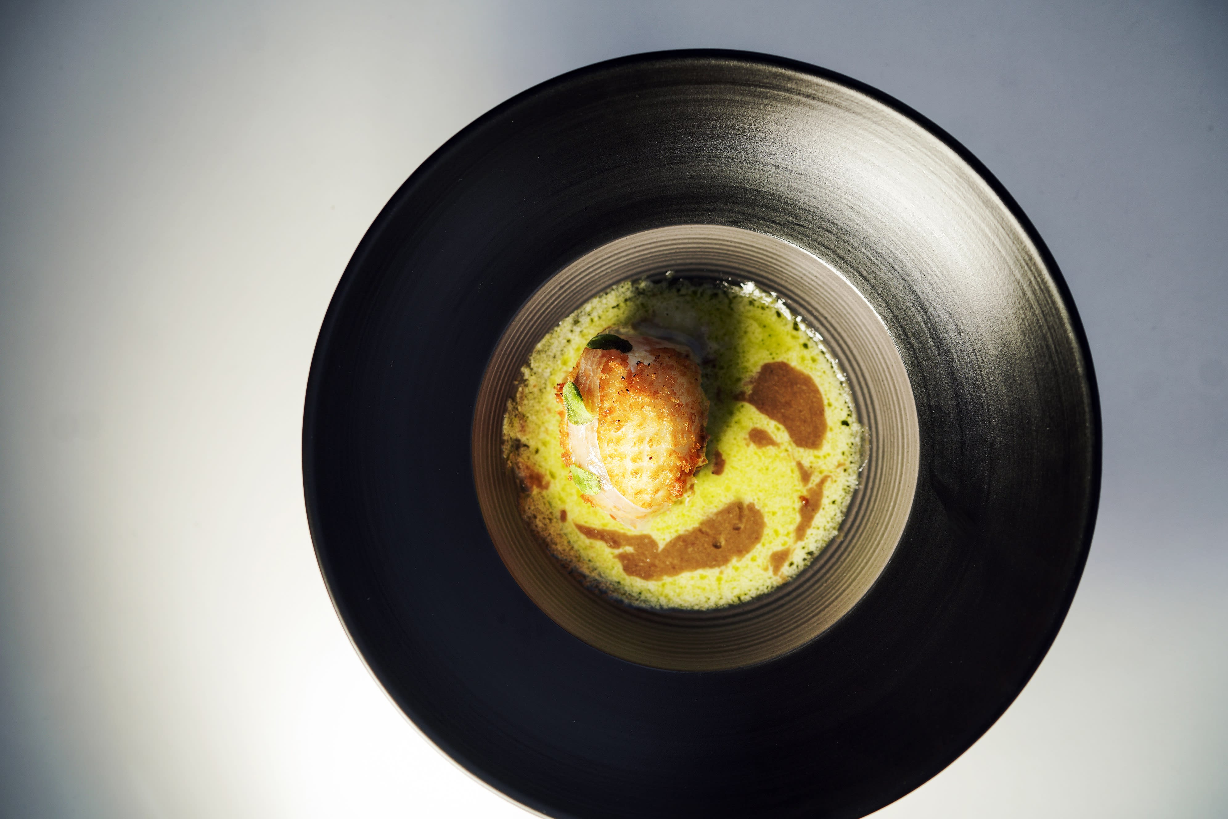 Ingen planet, men panert, fritert bløtkokt egg i parmesankrem. 