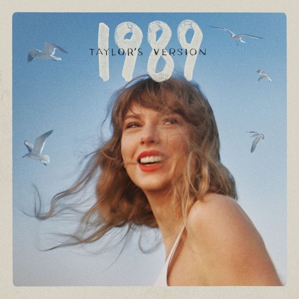 En albumforside hvor det står 1989 med en smilende kvinne med røde lepper med måker rundt