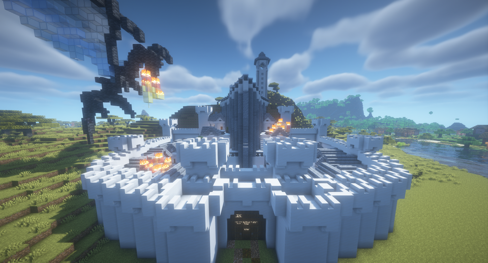 Bilde fra Minecraft hvor det er bygget en stor grå borg og det flyr en stor sort drage over og spruter ild. 