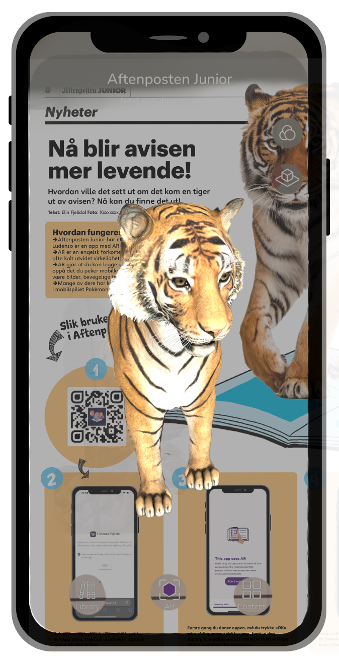 Et skjermbilde viser en side fra Aftenposten Junior-avisen og at en tiger som er animert står ut fra avisen. 