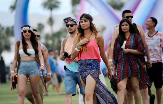 Coachella festivalgoers arrive at Empire Polo Field on day one of the 2014 Coachella Music and Arts Festival on Friday, April 11, 2014, in Indio, Calif. (Photo by Chris Pizzello/Invision/AP)