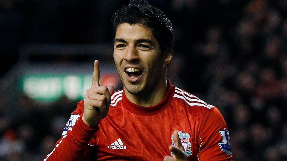 Liverpool's Luis Suarez celebrates after scoring during their English Premier League soccer match against Queens Park Rangers at Anfield in Liverpool, northern England December 10, 2011. REUTERS/Phil Noble (BRITAIN - Tags: SPORT SOCCER) FOR EDITORIAL USE ONLY. NOT FOR SALE FOR MARKETING OR ADVERTISING CAMPAIGNS. NO USE WITH UNAUTHORIZED AUDIO, VIDEO, DATA, FIXTURE LISTS, CLUB/LEAGUE LOGOS OR "LIVE" SERVICES. ONLINE IN-MATCH USE LIMITED TO 45 IMAGES, NO VIDEO EMULATION. NO USE IN BETTING, GAMES OR SINGLE CLUB/LEAGUE/PLAYER PUBLICATIONS