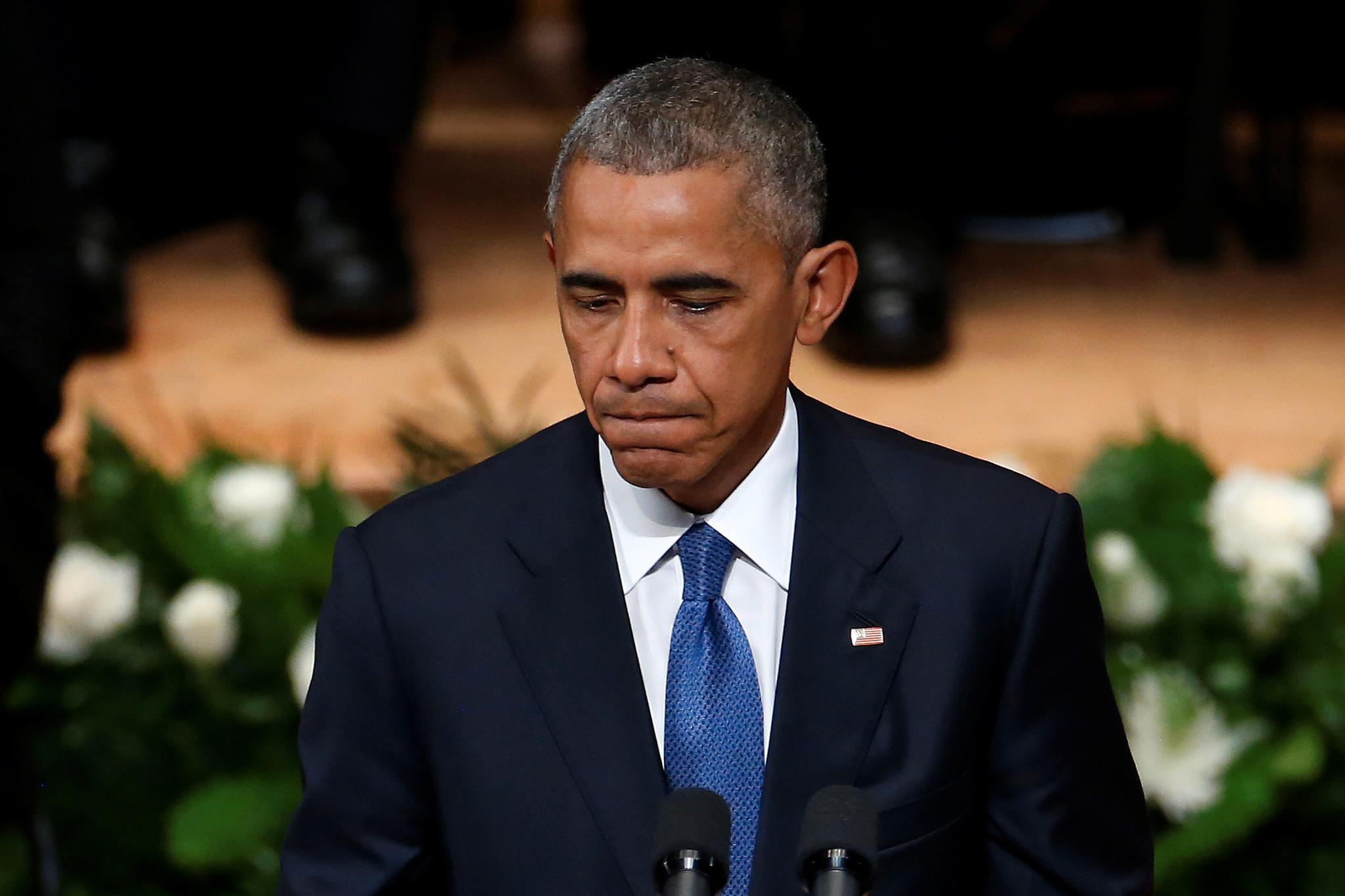 President Barack Obama taler under sørgehøytideligheten for de fem politimennene som ble drept i Dallas. Foto: Carlo Allegri / Reuters / NTB scanpix